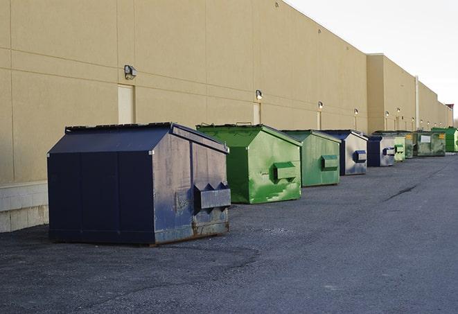 a large dumpster awaits materials from a renovation project in Bellwood